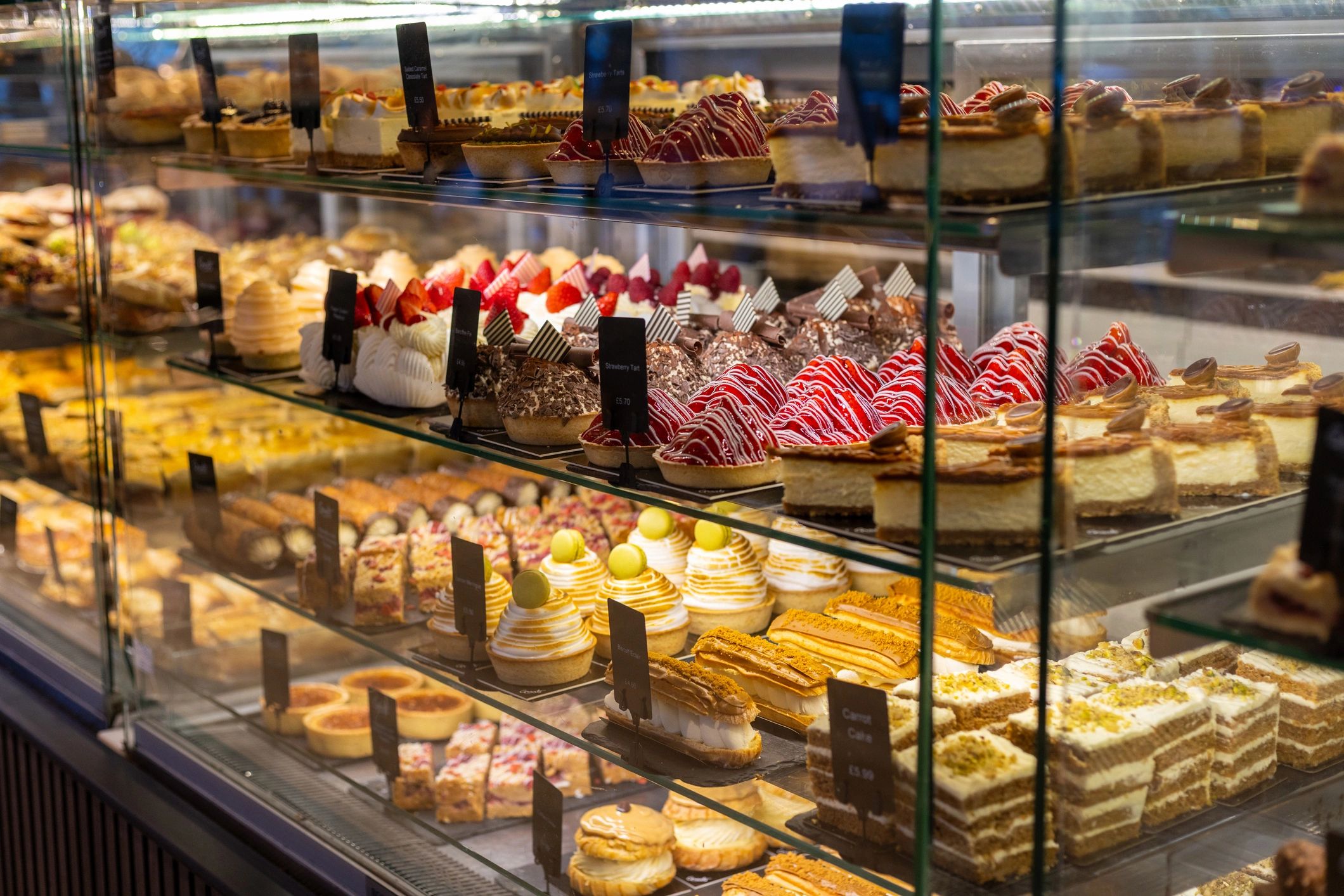 Artisan bakery case filled with cakes and pastries